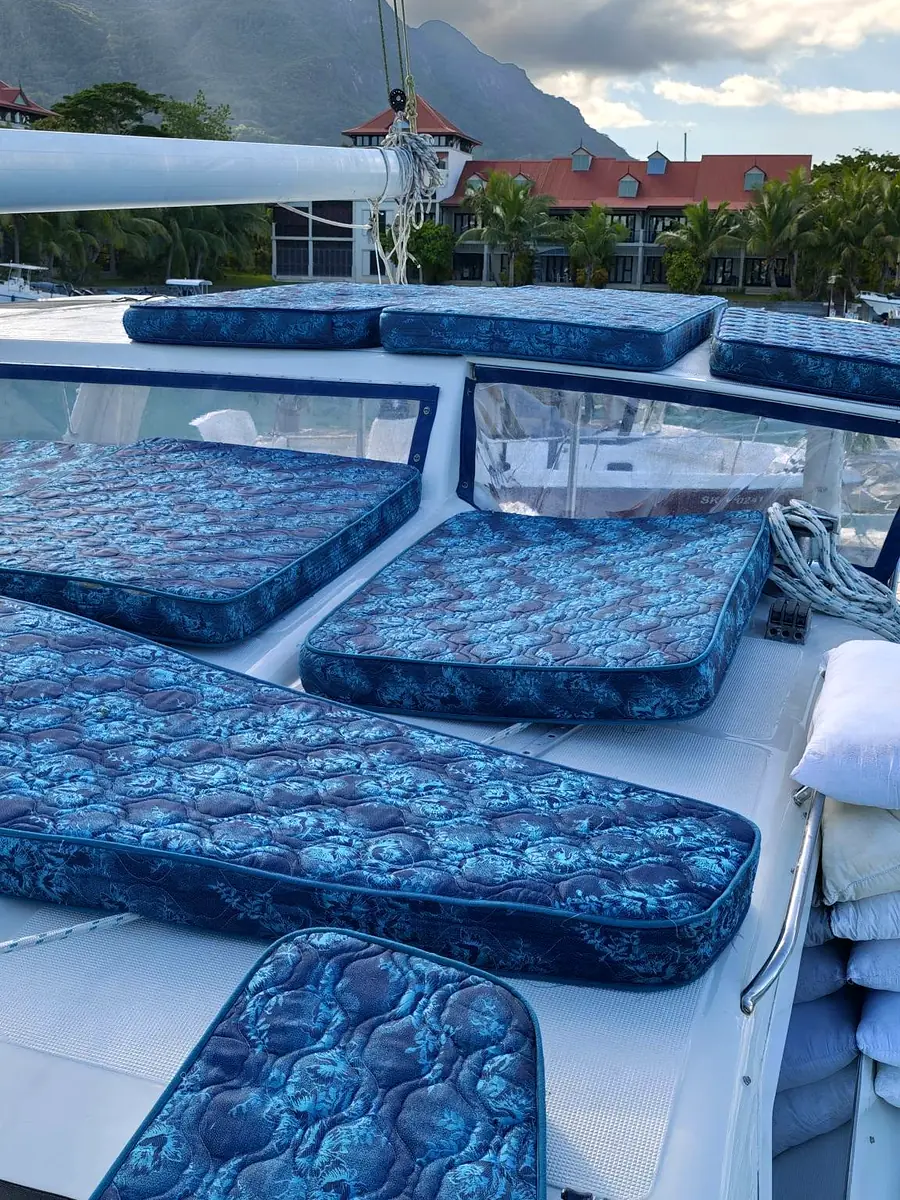 Cleaned deck cushions on a boat in a marina