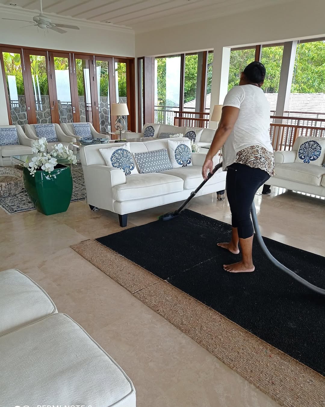 Carpet vacuuming in a luxury villa